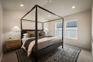 Bedroom with carpet, vaulted ceiling, and recessed lighting