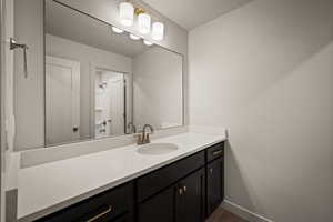 Bathroom with vanity and dark wood finished floors