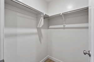 Walk in closet featuring light wood-type flooring