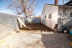 View of side of home featuring a chimney