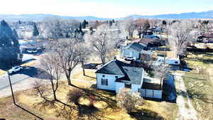 Aerial view of residential area featuring a mountainous background
