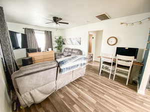 Bedroom featuring light wood-style flooring and a ceiling fan