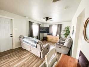 Bedroom with light wood-style floors and ceiling fan