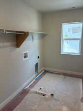 Laundry room with hookup for a washing machine and hookup for an electric dryer
