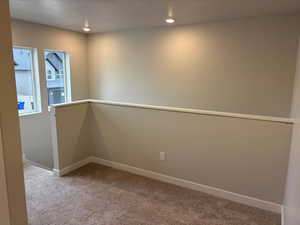 Unfurnished room featuring light colored carpet and recessed lighting
