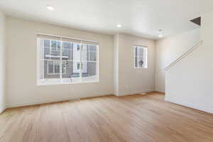 Unfurnished room featuring light wood-style flooring and recessed lighting