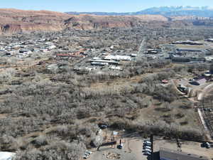 Aerial overview of property's location featuring a mountainous background