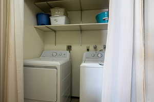 Laundry area with washer and clothes dryer