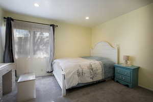 Carpeted bedroom featuring recessed lighting