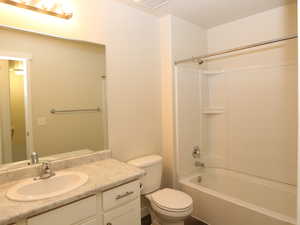 Bathroom with bathing tub / shower combination and vanity