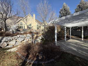 View of yard featuring a pergola and a patio area