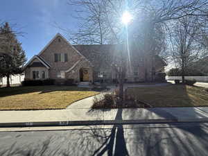 View of front of home featuring brick siding