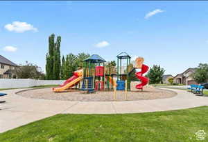 Community playground featuring a yard