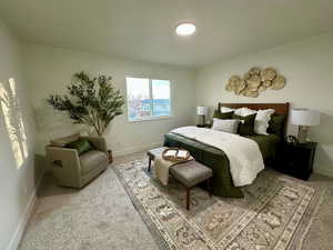 Bedroom with carpet and baseboards