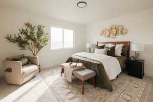 Bedroom featuring light colored carpet and baseboards