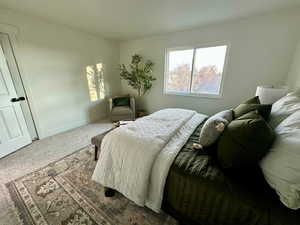 Carpeted bedroom with baseboards
