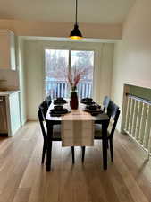 Dining space with light wood-style floors