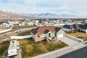 Aerial perspective of suburban area with a mountain backdrop