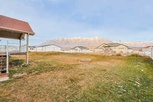 Fenced yard with a mountain view