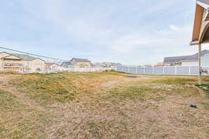 Fenced yard with a residential view