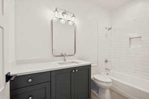 Full bath featuring shower / bath combination and vanity