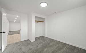 bedroom with a closet, carpet floors, and recessed lighting