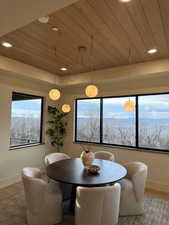 Dining area featuring wood finished floors, wooden ceiling, and recessed lighting