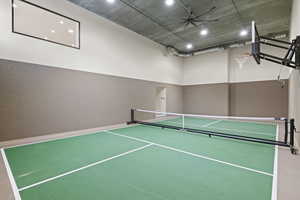 View of pickleball court featuring a ceiling fan