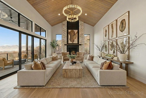 Living room with a mountain view, a fireplace, wood finished floors, and a vaulted wood ceiling