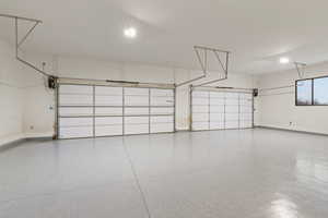 Garage featuring baseboards