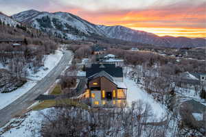 Snowy aerial view featuring a mountain view