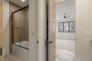 Bathroom with shower / bath combination with glass door, light carpet, recessed lighting, vanity, and ceiling fan