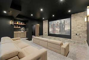 Home theater featuring wet bar, carpet floors, and recessed lighting