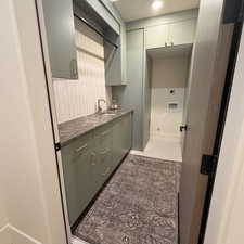 Bar area with baseboards and light tile patterned floors