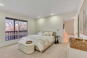 Bedroom featuring light carpet and recessed lighting