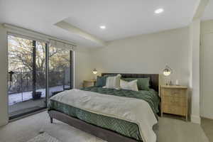 Carpeted bedroom with access to exterior and recessed lighting