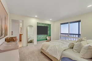 Carpeted bedroom with recessed lighting and baseboards