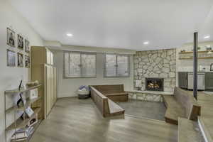 Living area featuring a fireplace and light wood-style flooring