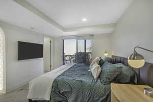 Carpeted bedroom with access to outside and recessed lighting