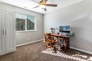Office with carpet and ceiling fan