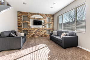 Living room with carpet and baseboards