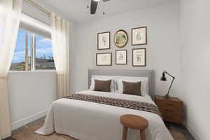 Bedroom featuring baseboards and ceiling fan