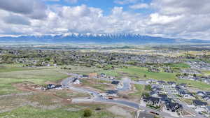 Aerial perspective of suburban area featuring a mountain backdrop