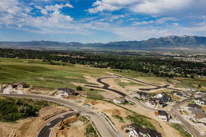 Aerial view of residential area featuring a mountain backdrop