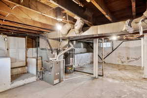 Below grade area with water heater and heating unit