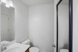 Bathroom with toilet and vanity