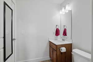 Bathroom with vanity and light wood finished floors