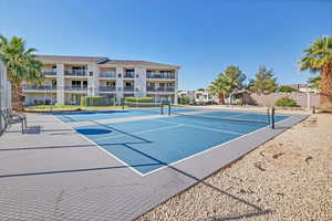 View of tennis court featuring community basketball court