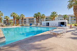 Community pool with a patio area
