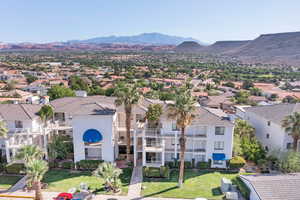 Aerial perspective of suburban area with a mountain backdrop